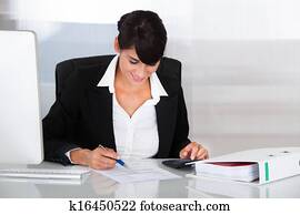 Businesswoman Working With Calculator