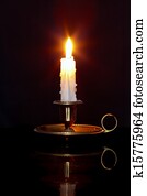 Candle in brass chamberstick