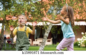 Children playing at the garden Children playing at the garden
