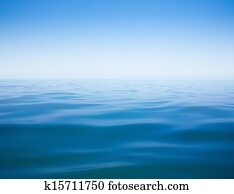 clear sky and calm sea or ocean water surface background