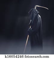 death with scythe standing in the fog at night death with scythe standing in the fog at night