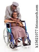 disabled senior african woman and her caring husband 
