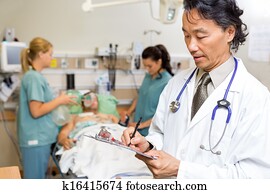 Doctor Writing Notes in Emergency