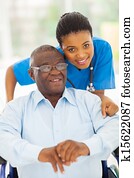 elderly african american man and caring young caregiver elderly african american man and caring young caregiver