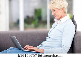 elderly woman using laptop computer