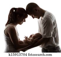 Family with newborn baby. Parents silhouette over white Family with newborn baby. Parents silhouette over white