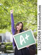 gemischtrassig, weiblicher student, halten, tafel, mit, a+, geschrieben