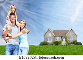Happy family near new home.