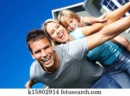 Happy family near the house