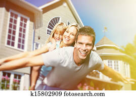 Happy family near the house
