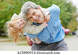 Happy father and daughter outdoors