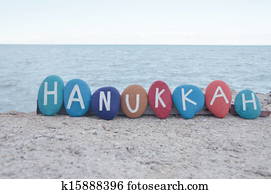 Happy Hanukkah on colourful stones Happy Hanukkah on colourful stones