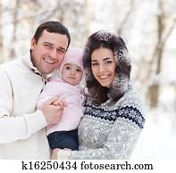Happy smiling family with at the winter 