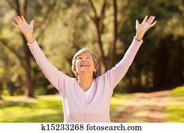healthy elderly woman arms outstretched