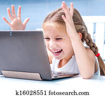 little girl with her computer