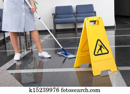 Maid Cleaning The Floor Maid Cleaning The Floor