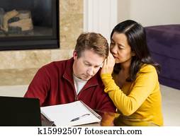 Mature woman whispering into Coworker ear