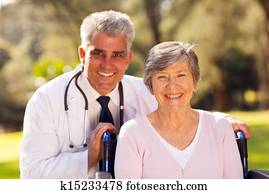 medical doctor with senior patient outdoors
