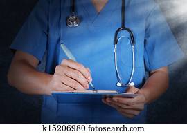 medical doctor with stethoscope writing