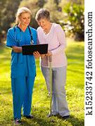 nurse showing senior patient medical test results