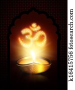 oil lamp with om sign over dark background oil lamp with om sign over dark background