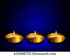 oil lamp with place for diwali greetings over dark background oil lamp with place for diwali greetings over dark background