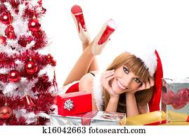 Portrait of beautiful sexy woman wearing santa claus clothes