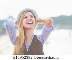 Portrait of happy hipster girl rejoicing in the city