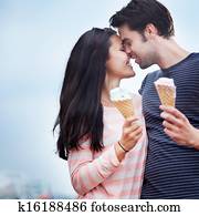 romantic couple face to face with ice cream