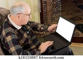 Senior man using a laptop computer