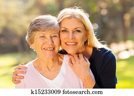 senior woman and middle aged daughter