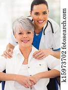 senior woman in wheelchair with caregiver