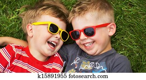Smiling brothers wearing fancy sunglasses