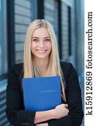 Smiling young job applicant with her CV