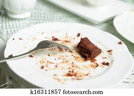 Soiled cake plates on rattan table