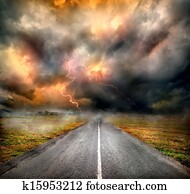 Storm clouds and lightning over highway Storm clouds and lightning over highway