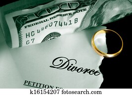 torn divorce decree and cash, with wedding ring torn divorce decree and cash, with wedding ring