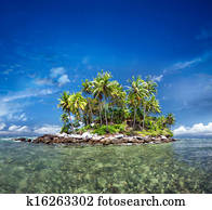 Tropical island with exotic green plants and coconut trees in clear sea water. Travel destination scenery tourism landscape background. Sunny day in Thailand paradise