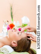 Wellness - woman getting head massage in Spa