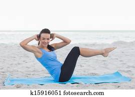 Woman doing abdominal crunches Woman doing abdominal crunches