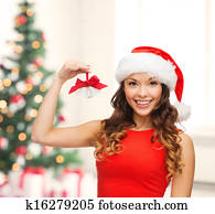 woman in santa helper hat with jingle bells