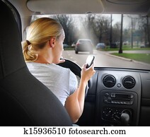 Woman Texting on Phone and Driving Car