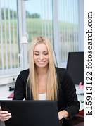 Woman working at her computer in the office