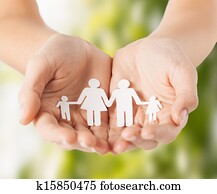 womans hands with paper man family womans hands with paper man family