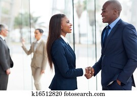 african business people handshaking