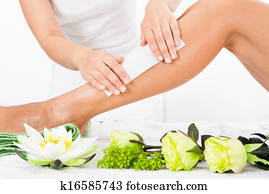 Beautician Waxing A Woman's Leg Beautician Waxing A Woman's Leg