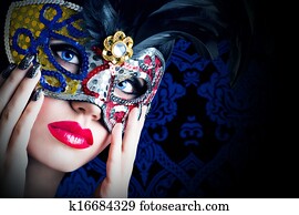 Beautiful model in carnival mask with red lips Beautiful model in carnival mask with red lips
