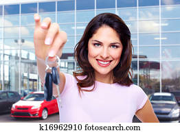 Beautiful woman with a car key.