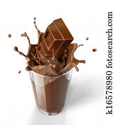 Chocolate cubes splashing into a chocolate milkshake glass. Chocolate cubes splashing into a chocolate milkshake glass.