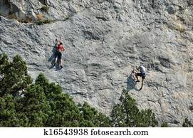 Climbers on the sheer rock